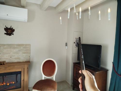 TV a/nebo společenská místnost v ubytování La maison des sortilèges