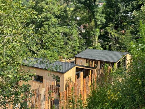 a wooden house in the middle of a forest at Domaine des Constellations - Tiny Houses & Bains Nordiques in Orbey