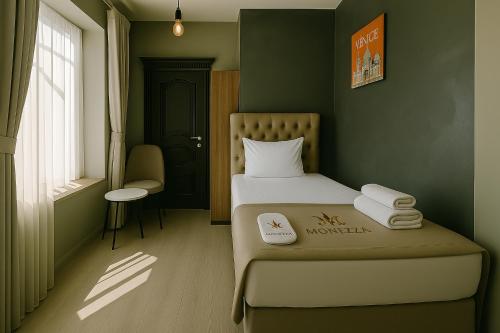 A bed or beds in a room at Monezza Avcılar