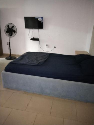 Postel nebo postele na pokoji v ubytování SleepPrayEatGo