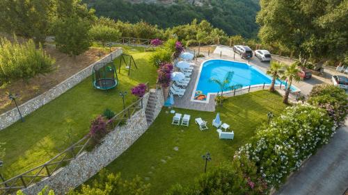an overhead view of a backyard with a swimming pool at Arcaloro Resort Rooms in SantʼAngelo di Brolo