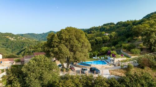 an aerial view of a resort with a swimming pool at Arcaloro Resort Rooms in SantʼAngelo di Brolo
