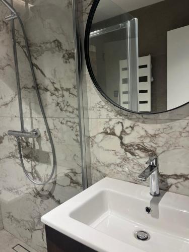 a bathroom with a sink and a mirror at Casa Del Sol Pietra Kotor in Kotor
