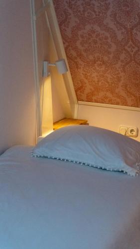 Ένα ή περισσότερα κρεβάτια σε δωμάτιο στο Vakantiewoning De Pastorie