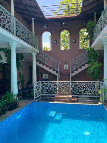 a house with a swimming pool and stairs at Mandaram villas in Mararikulam
