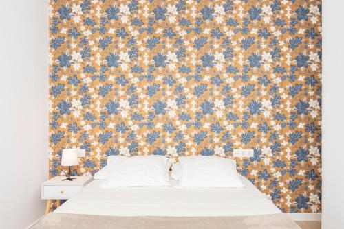 Ένα ή περισσότερα κρεβάτια σε δωμάτιο στο Flowers Houses