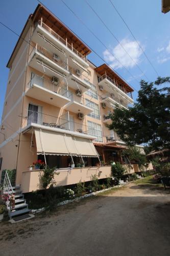 a large apartment building with stairs in front of it at Stef & Stam Nerantzis in Himare