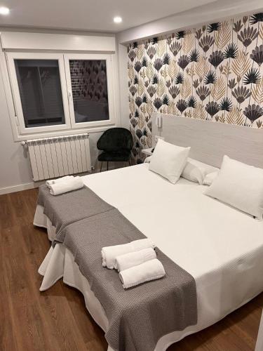 Postel nebo postele na pokoji v ubytování Sleep Padrón