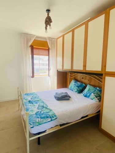 a bedroom with a bed with a wooden frame at Authentic Puglia Seaside Condo in Scalo dei Saraceni Manfredonia
