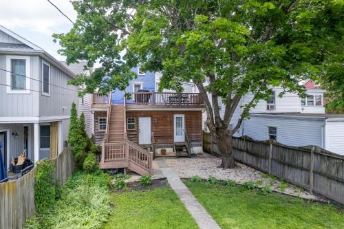 a home with a wooden fence and a tree at Historic Downtown Gettysburg Gem in Gettysburg