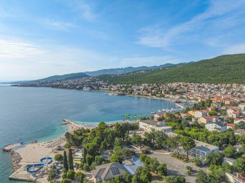 an aerial view of a town on the shore of a body of water at Hotel Slaven in Selce