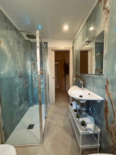 a bathroom with a sink and a shower at Amor home b&b - 200m dalla metro A Subaugusta in Rome