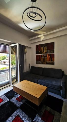 a living room with a couch and a coffee table at Chalkida Center Hideaway in Chalkida