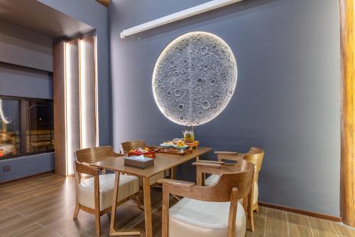 a dining room with a table and chairs at Xingshengjiu Courtyard Hotel Pingyao in Pingyao