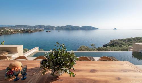 a table with a view of a body of water at Villa myporos in Poros