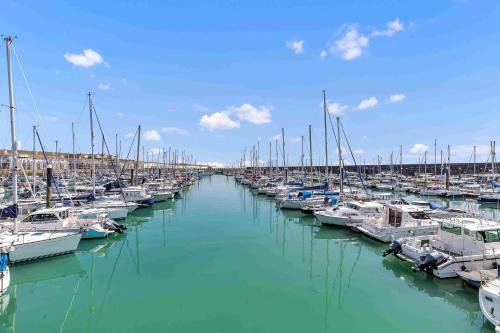 a bunch of boats docked in a harbor at On the Water 7 Free Parking By My Getaways in Brighton & Hove
