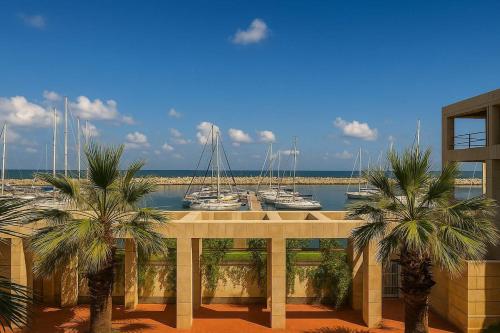 a view of a marina with boats in the water at Magnificent 3BR-2BA in Marina Herzliya w Pool in Herzliyya B