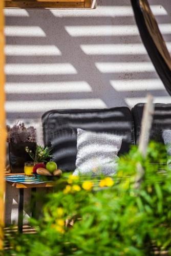 a table with fruits and vegetables on top of a stairs at Aloha Studio in La Oliva