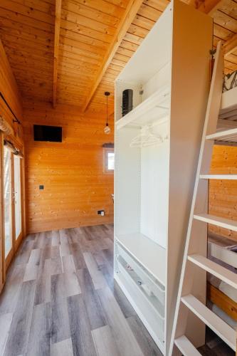 a room with a closet and wooden ceilings at Aloha Studio in La Oliva