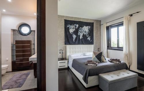 a bedroom with a bed and a bathroom at Lovely Home In Velletri With Wifi in Velletri