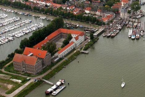 an aerial view of a marina with boats at Hotel Oostereiland in Hoorn