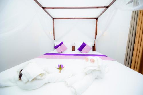 Katil atau katil-katil dalam bilik di Ashwin Ayurveda Villa