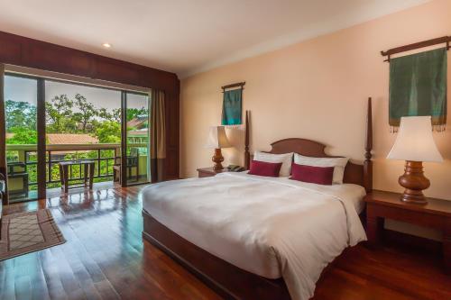 A bed or beds in a room at Prince Angkor Hotel & Spa