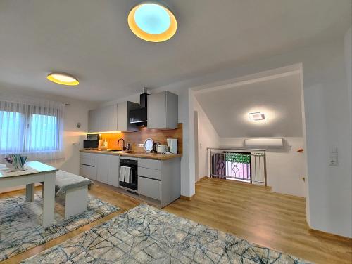 a kitchen with a table and a counter top at Apartman Una Paradies in Bihać