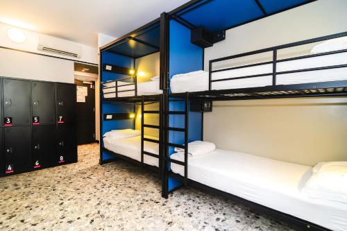 a bunk room with four bunk beds in it at YellowSquare Milan in Milan