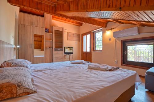 Postel nebo postele na pokoji v ubytování Villa Bela