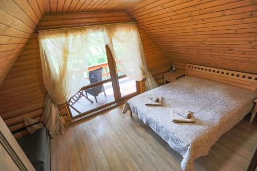 Postel nebo postele na pokoji v ubytování Atpūtas komplekss Lilaste