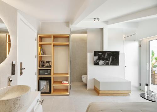 a bathroom with a toilet and a sink at Hotel restaurant Ceferino in Vilanova i la Geltrú
