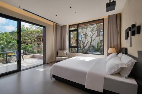 Una cama o camas en una habitación de JIYU Hotel