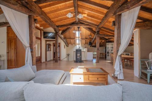 a living room with two couches and a table at Biendella El Desván 