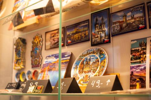 a display of plates on a wall in a store at Prague Dream Hostel in Prague