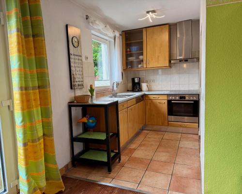 a small kitchen with a sink and a counter at Ferienweingut Matthias Löwen in Detzem