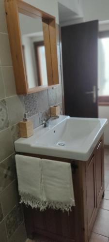 a bathroom with a sink and a mirror at La Casa di Fedora in Capestrano