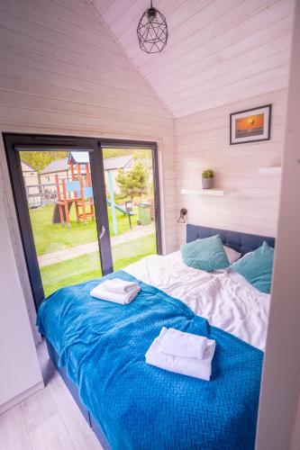 Letto o letti in una camera di Pod Cyprysami - surf & family resort