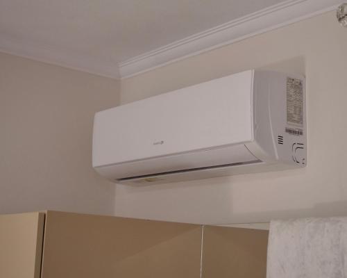 a microwave oven hanging from the ceiling in a bathroom at Sofra e Vjeter Restaurant and Guesthouse in Bregu i Lumit