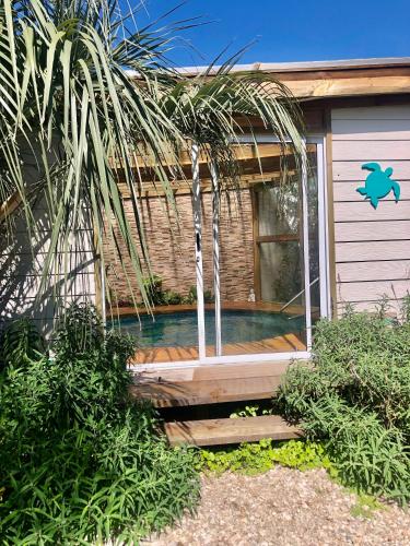 a house with a swimming pool in front of it at Posada Agua Marina in La Paloma