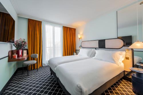 Katil atau katil-katil dalam bilik di Hotel Faubourg Galant Paris - Handwritten Collection