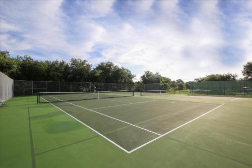 a tennis court with two tennis rackets on it at 974 Rotunda in Rotonda West