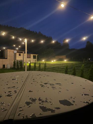 a view of a street at night with lights at Górna Kudowa Domki Wypoczynkowe z balią in Kudowa-Zdrój