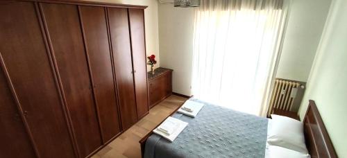 Postel nebo postele na pokoji v ubytování Monte Generoso