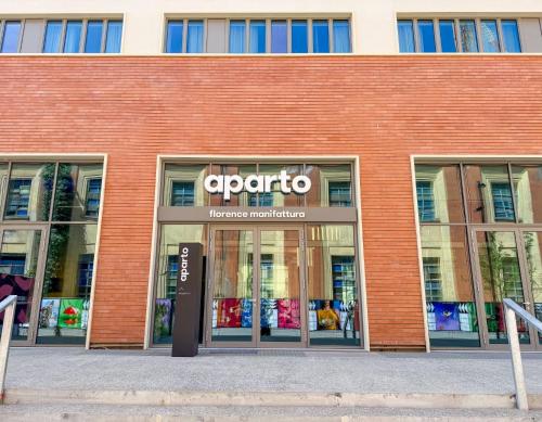 a store front of a brick building at NEW OPENING 2025 aparto Florence Manifattura in Florence