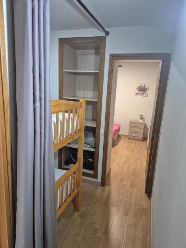 a room with a stair case and a mirror at APT4 Encantador al Centre de Vic APTGARBI in Vic