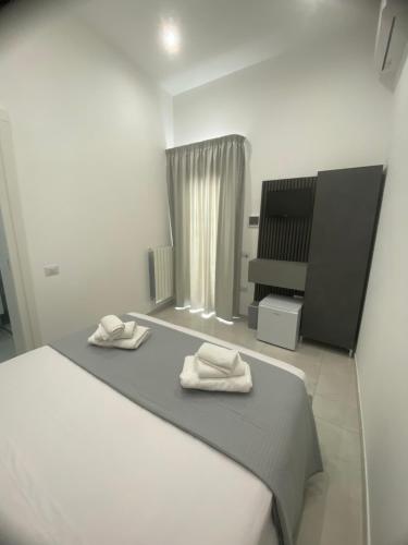 Ένα ή περισσότερα κρεβάτια σε δωμάτιο στο NOGA rooms