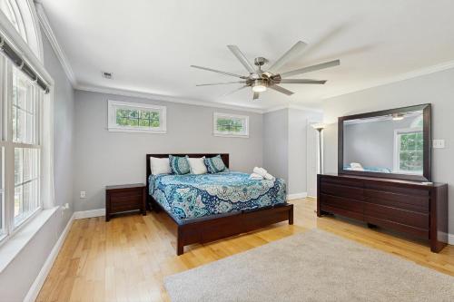 a bedroom with a bed and a ceiling fan at Forest Cove in Mineral