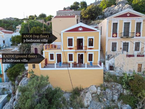 a house on the side of a mountain at Lirenou Scala Vista in Symi