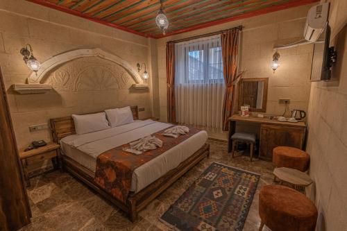 Postel nebo postele na pokoji v ubytování Cordial Cappadocia Hotel